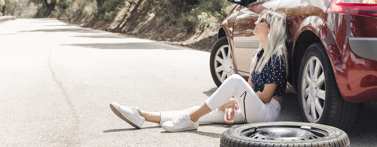 Woman Next To Car Waiting On Flat Tire Service Call
