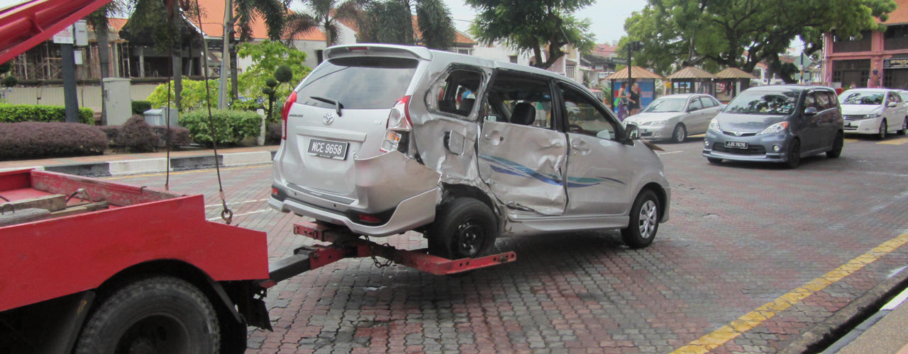 Hauling Away A Van For Accident Recovery Service Call