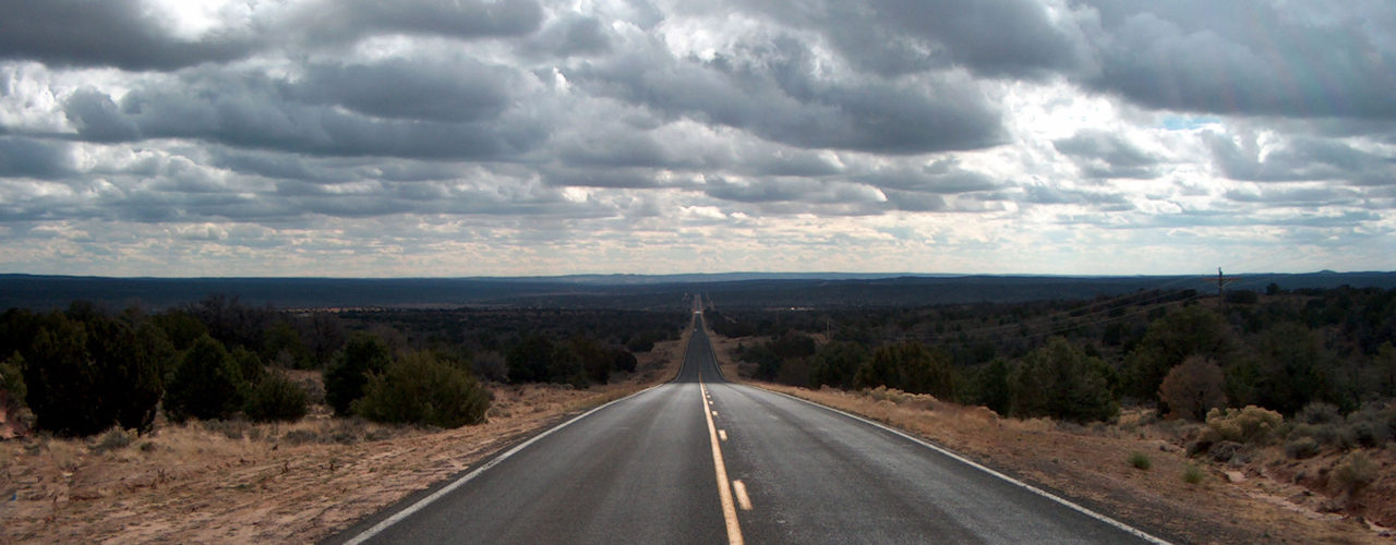 Lonely Highway During Long Distance Towing Service Job
