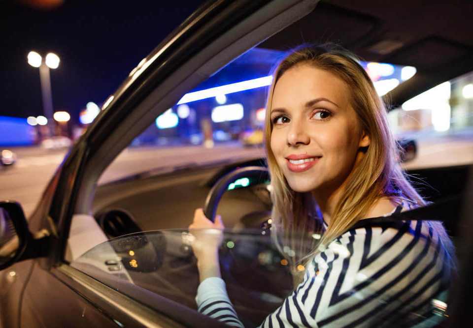 a lady driving at night