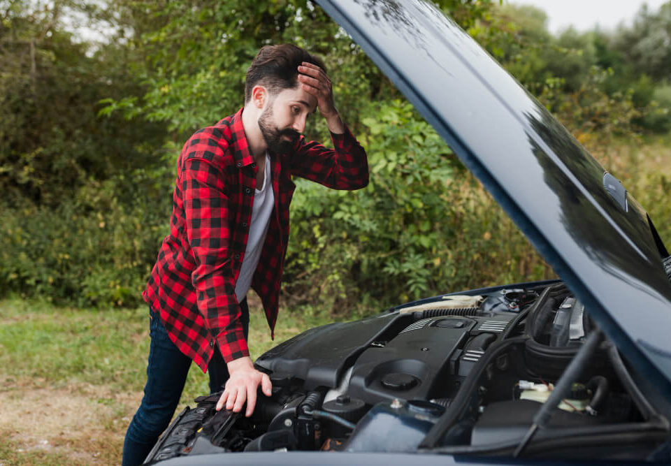 man wondering why his car battery is dead again