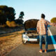 man with a disabled car on the side of the road