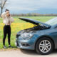 woman with her car broken down and away from home.
